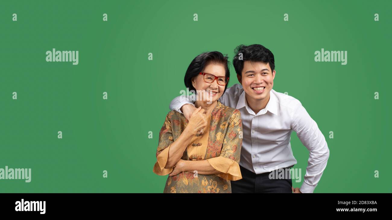 Adult son comimg home and hug mother on the mothers day Stock Photo