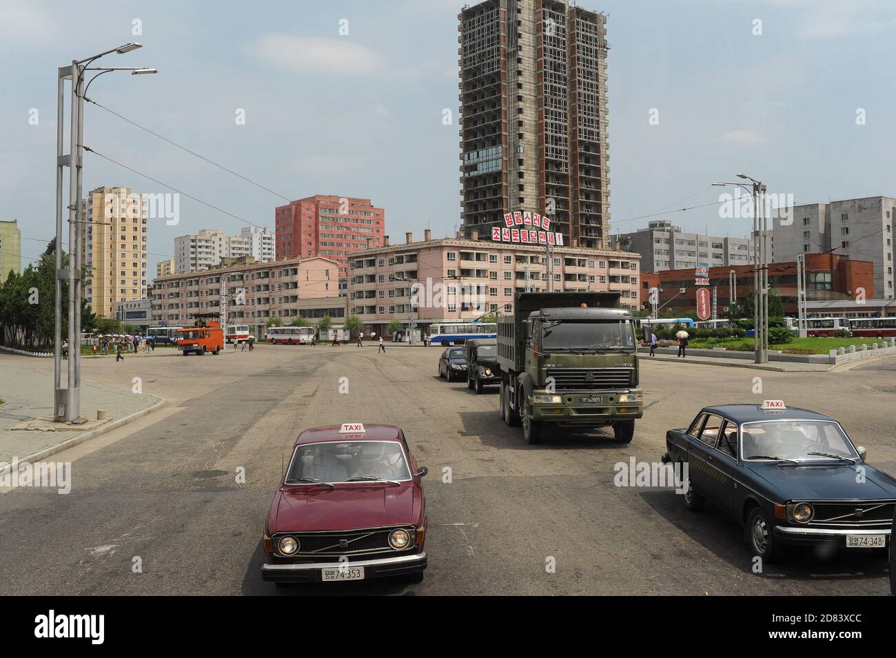 08.08.2012, Pyongyang, North Korea, Asia - An everyday street scene with road traffic and buildings in the centre of the North Korean capital city. Stock Photo