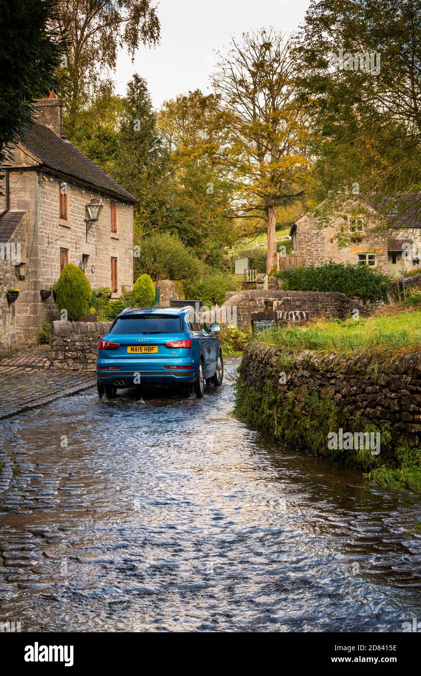 UK, England, Staffordshire, Moorlands, Butterton, Pothooks Lane, car in Hoo Brook flowing through cobbled ford Stock Photo