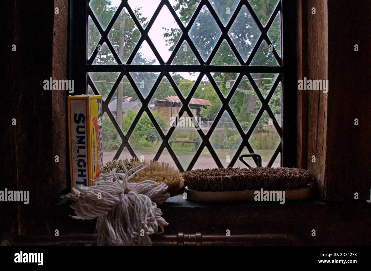 Vintage cleaning materials in the window of teh scullery at Brockhampton Medieval Manor House, Herefordshire, UK Stock Photo