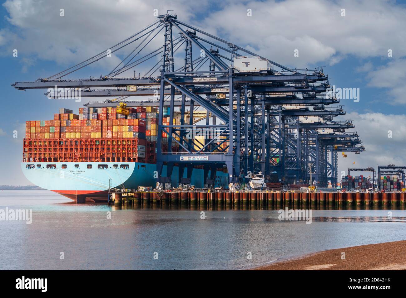 view of massive maersk container ship unloading container freight at felixstowe port suffolk Stock Photo