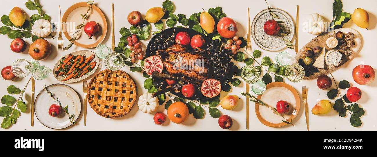 Thanksgiving dinner or family gathering with roasted duck and