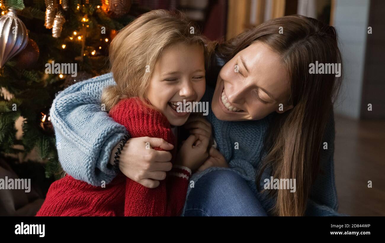 Banner view of overjoyed mom and small daughter have fun Stock Photo