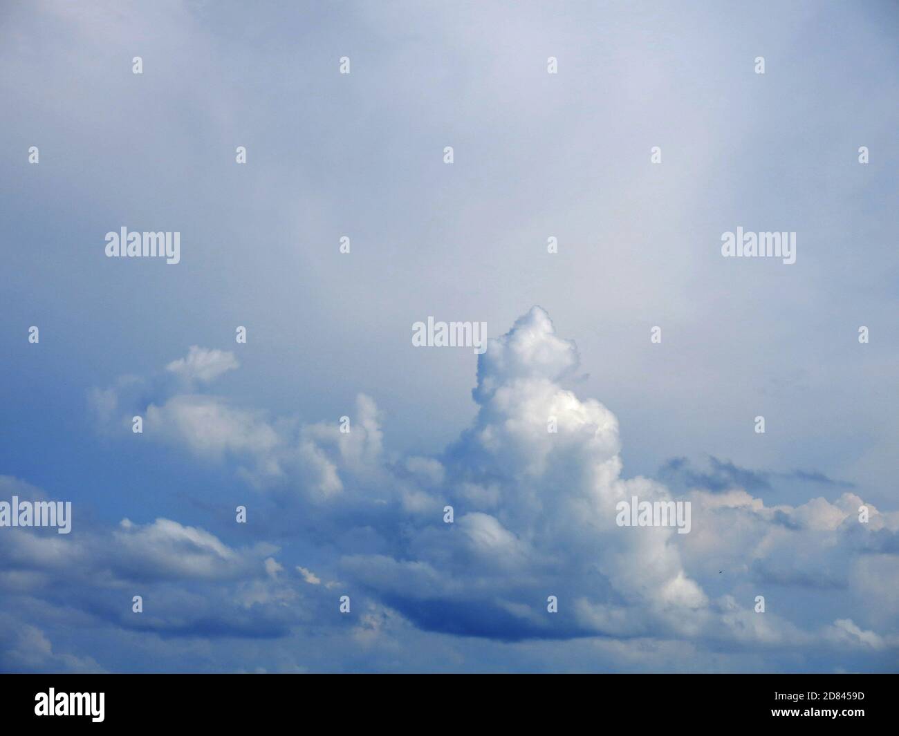 Stratus and Cumulus clouds as seen in overcast sky. Stock Photo