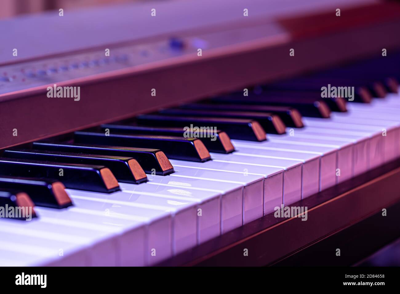 Piano keys on a beautiful colored background. Close up Stock Photo - Alamy