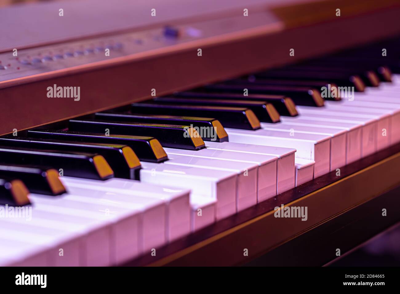 Piano keys on a beautiful colored background. Close up Stock Photo Alamy