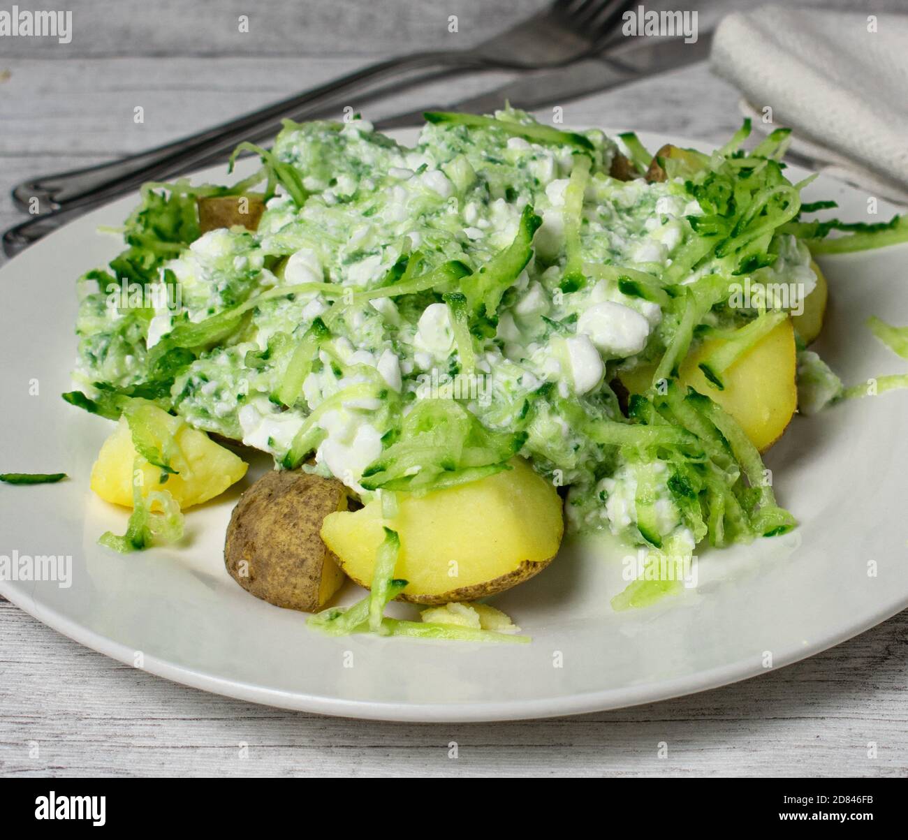 Cottage cheese salad with jacket potatoes Stock Photo