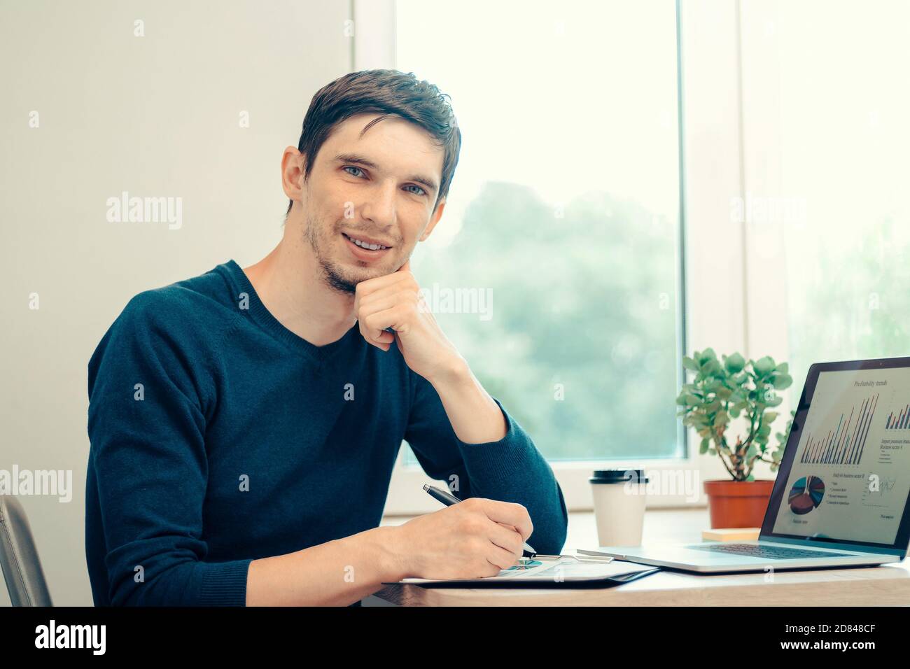 close up. casual young man analyzing financial data . Stock Photo