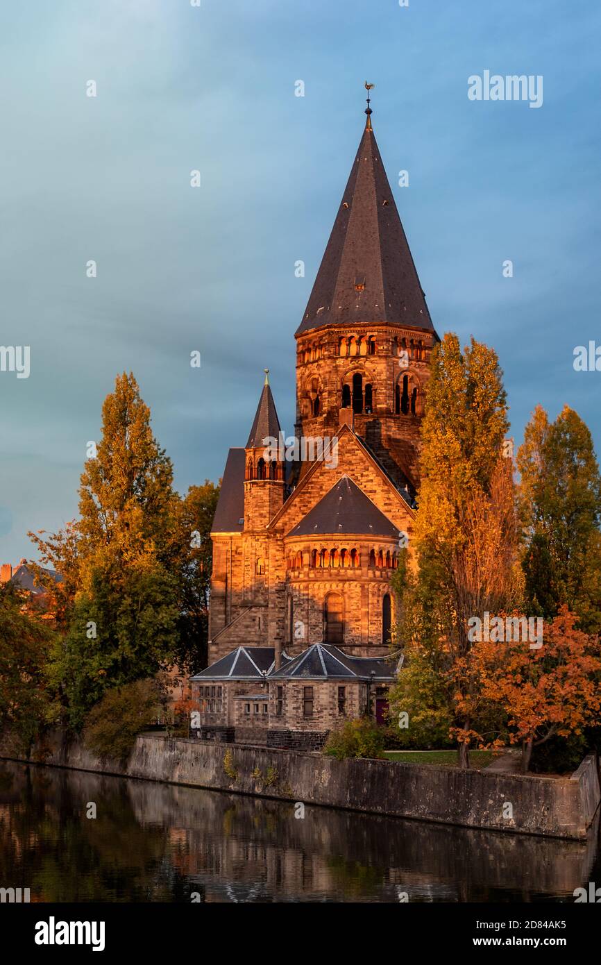 the golden hour coloring the church architecture in the city of metz in ...