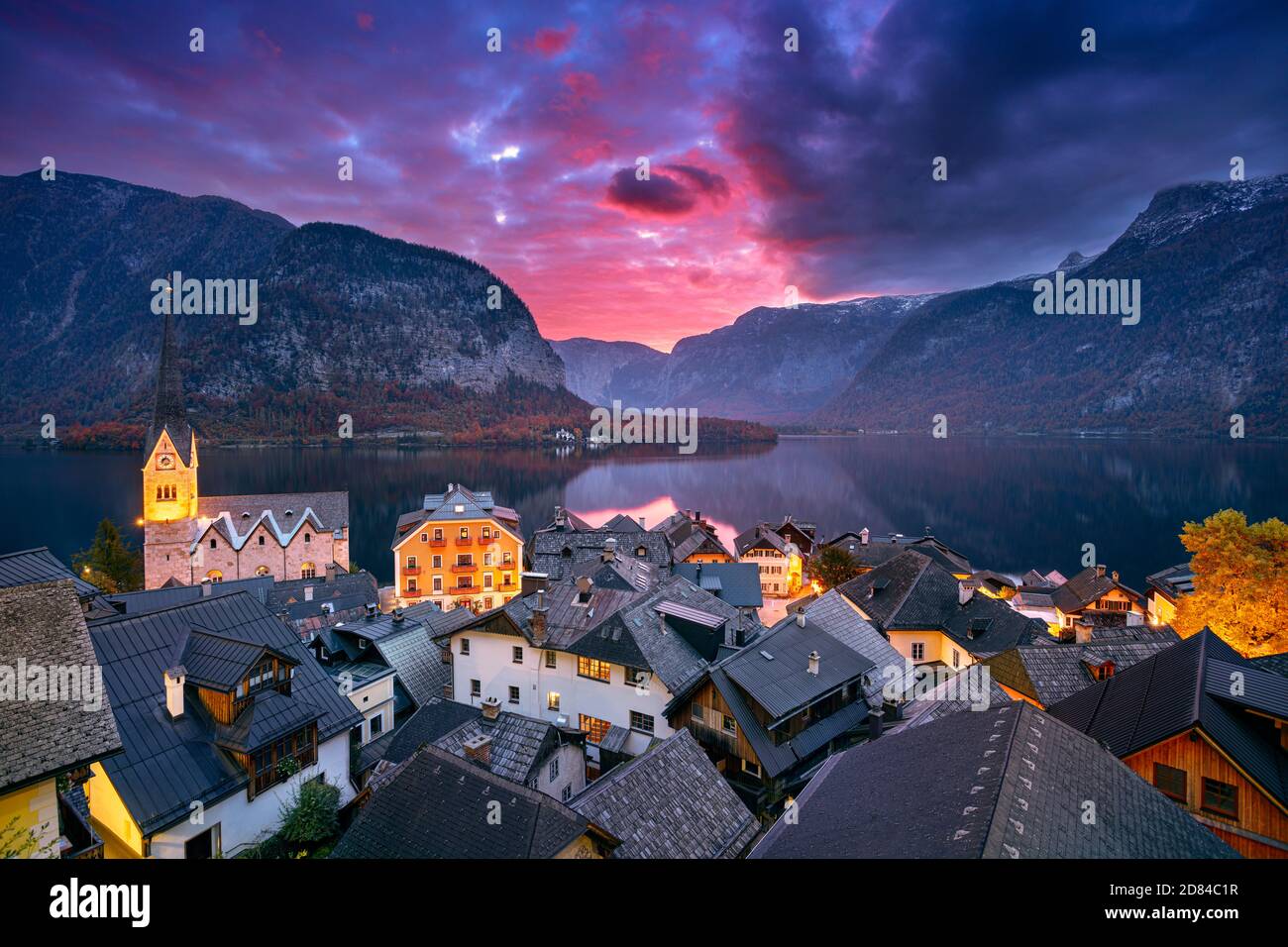 Hallstatt, Austria. Cityscape image of iconic alpine village Hallstatt at dramatic autumn sunrise. Stock Photo