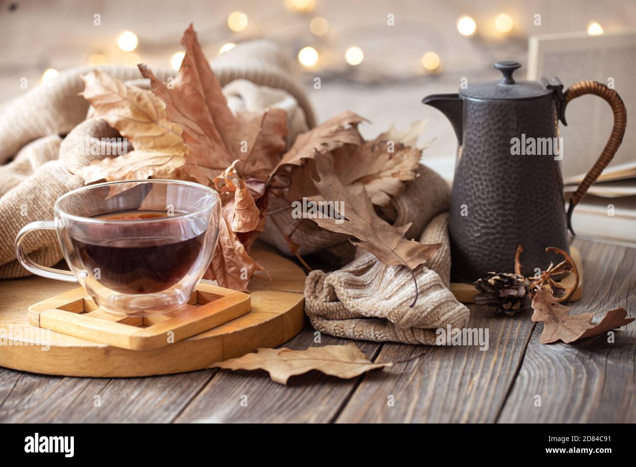 Cozy autumn still life in a homely atmosphere with decorative items. Stock Photo