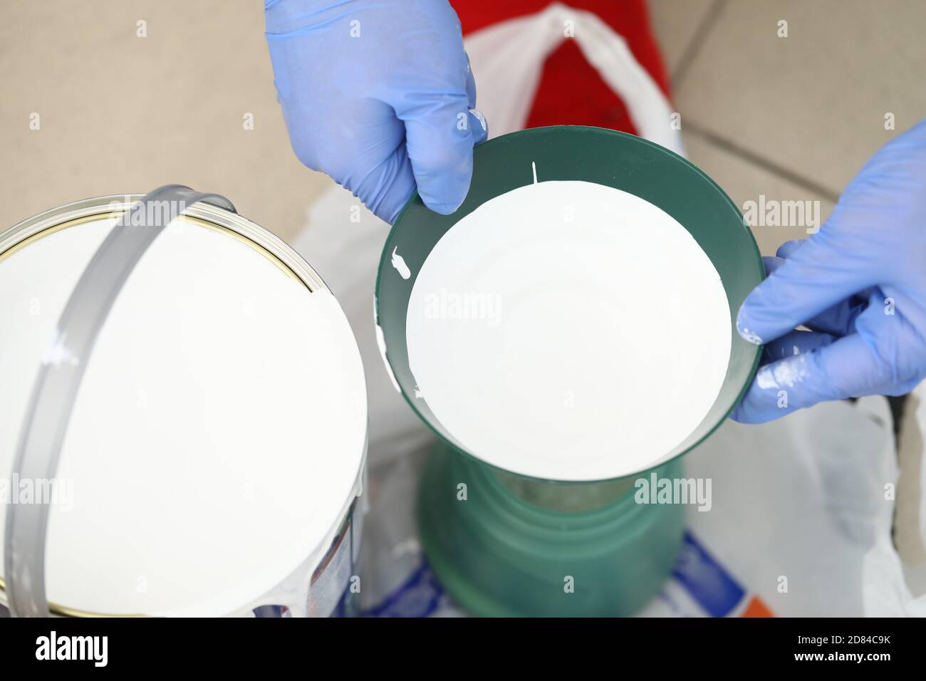 White paint in can and in building tank closeup Stock Photo Alamy
