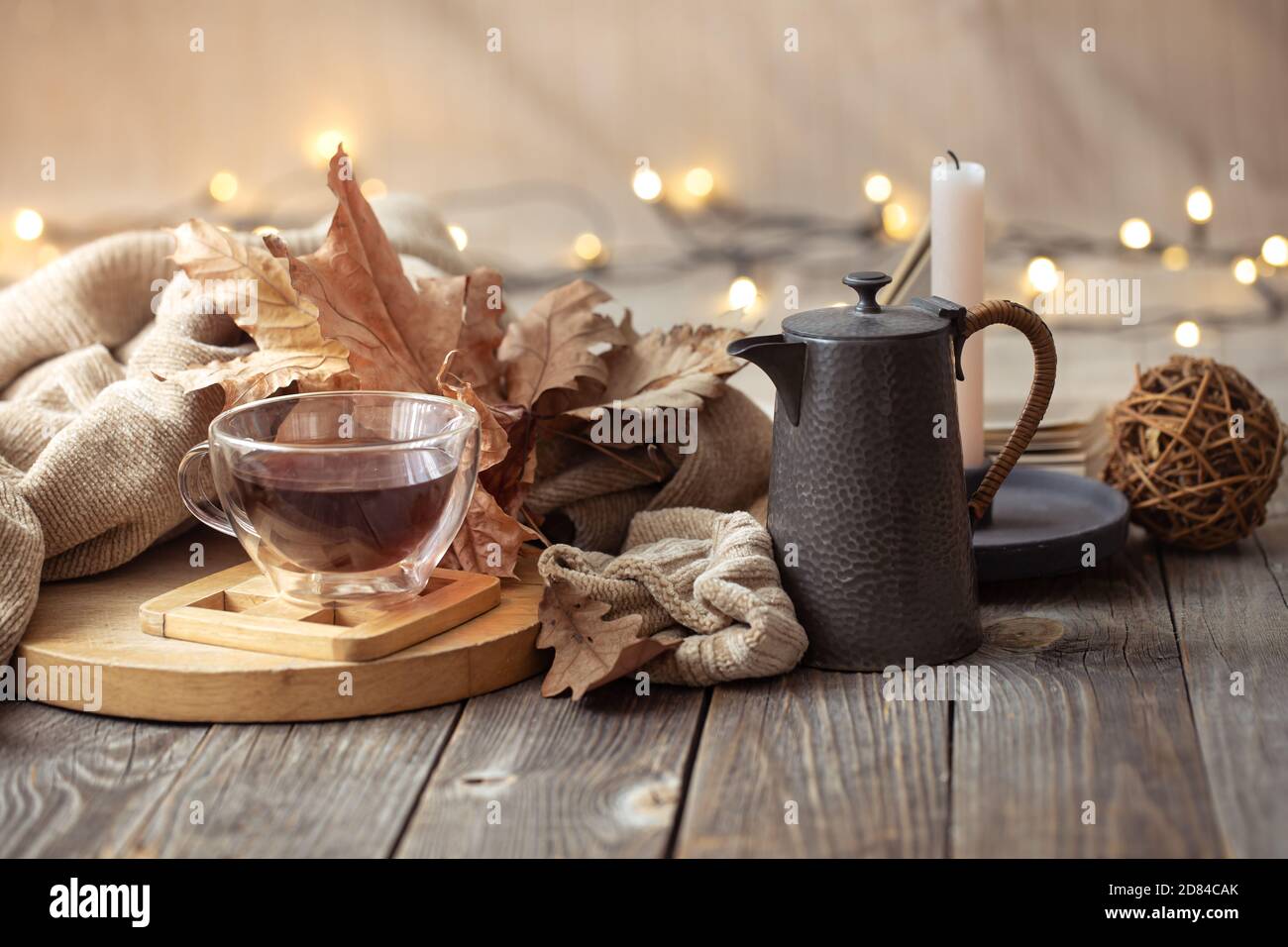 Cozy autumn still life in a homely atmosphere with decorative items. Stock Photo