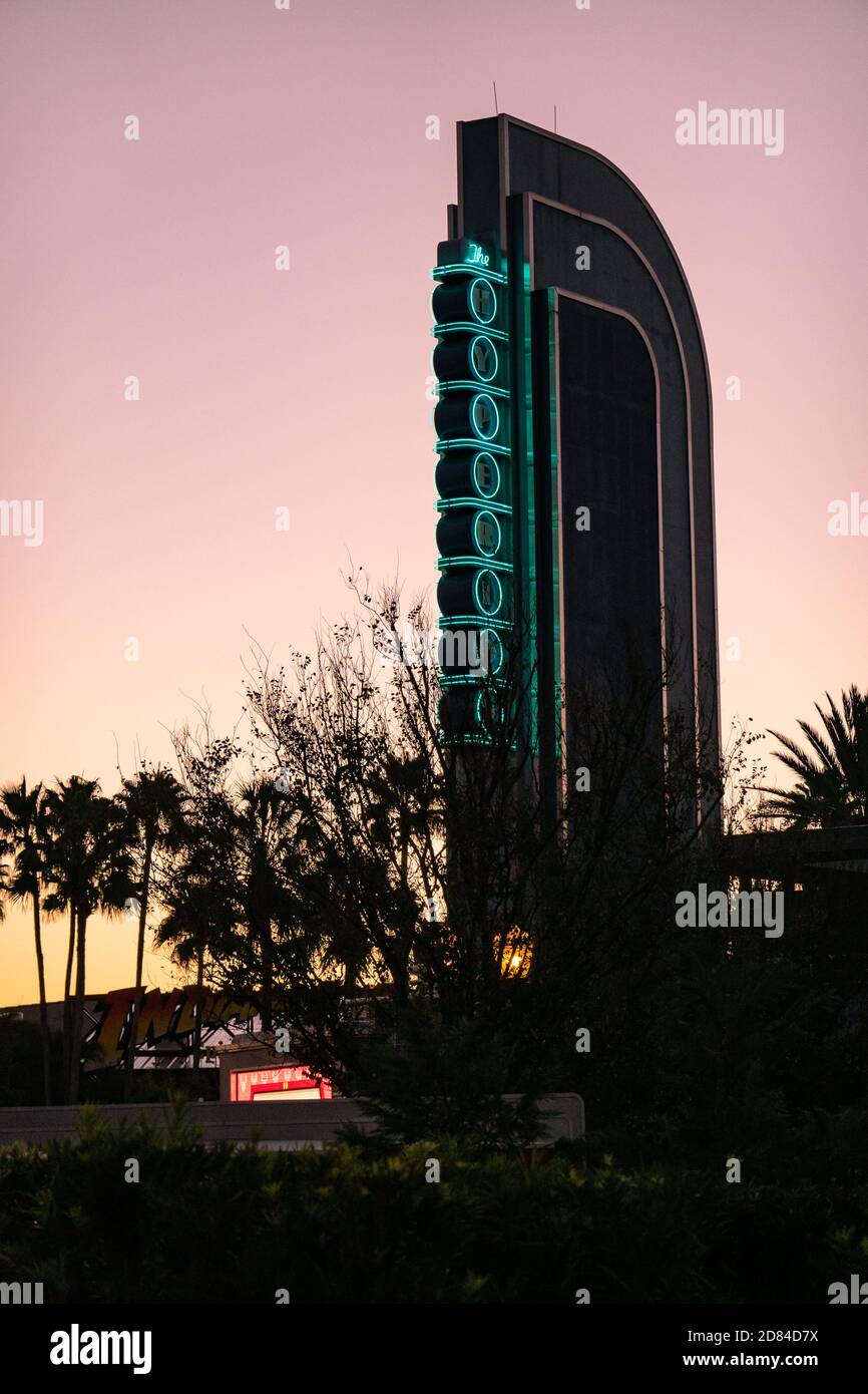 The illuminated sign of The Hyperion Theatre in Disney's Hollywood Studios, Disney World against a pink sunrise sky Stock Photo
