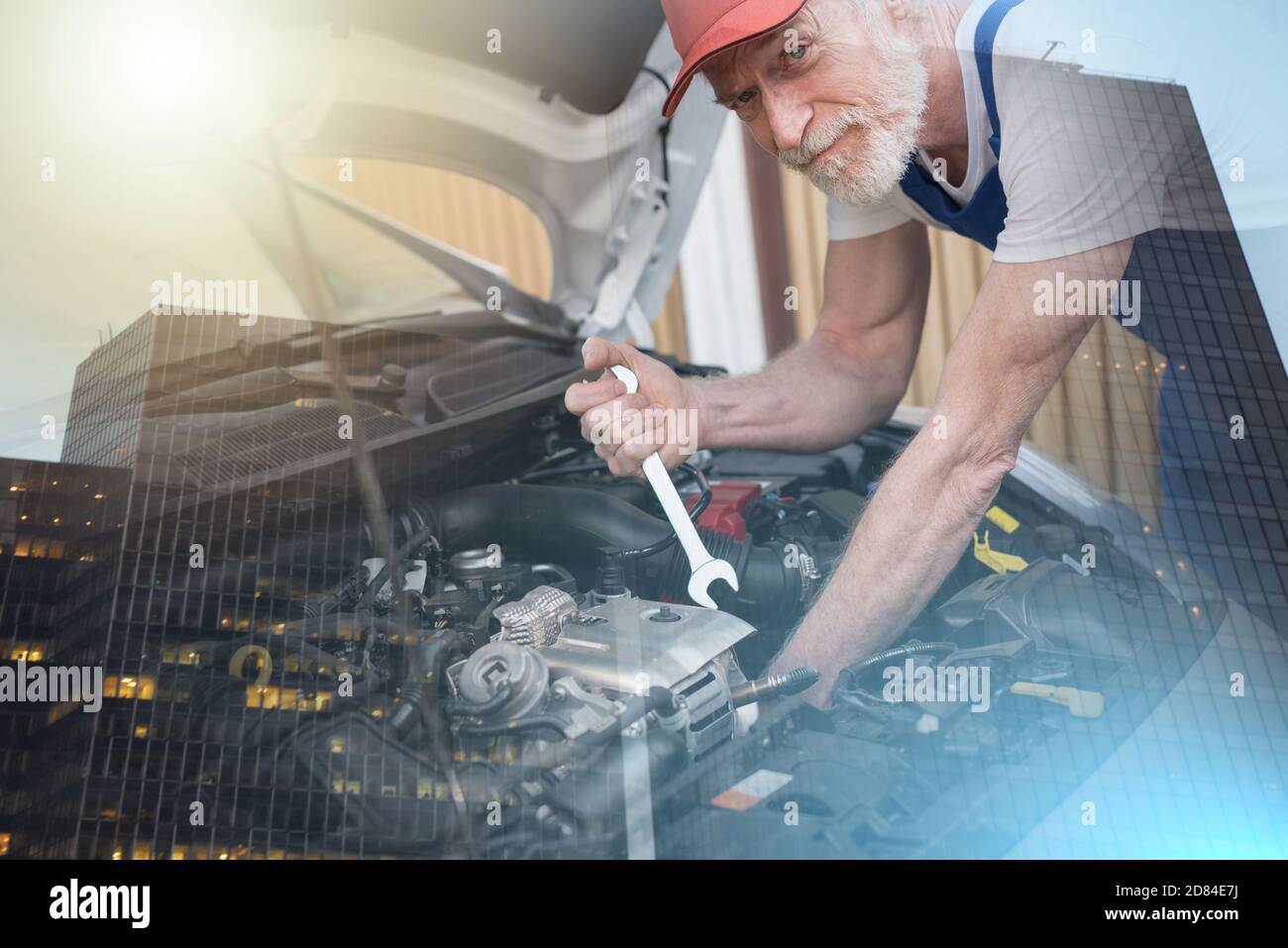 Car mechanic repairing a car engine; multiple exposure Stock Photo - Alamy