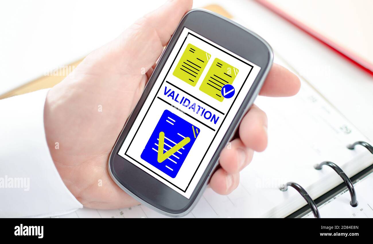 Validation concept shown on a smartphone screen Stock Photo