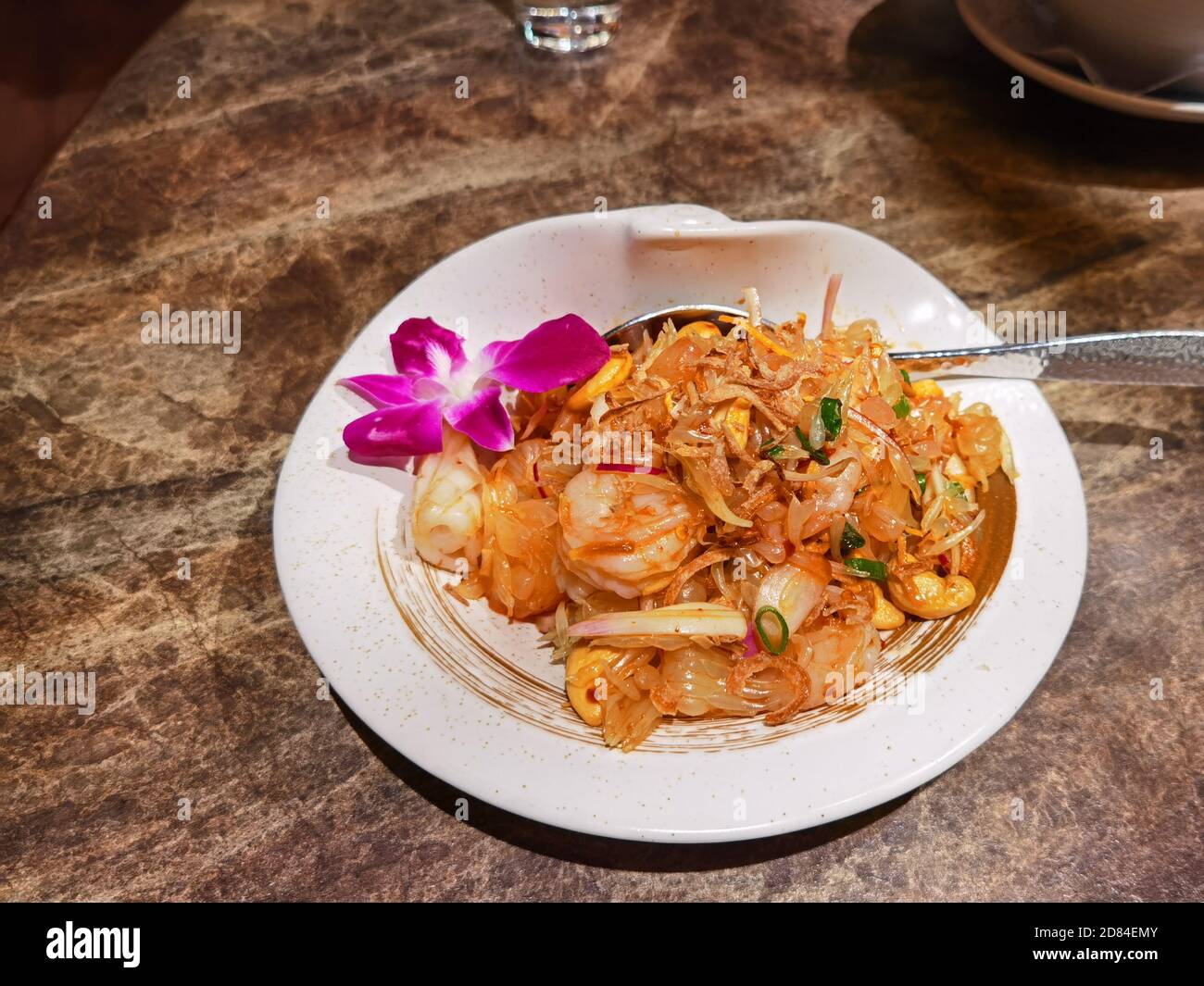 Shrimp, Squid and Pomelo Salad with Dry Fish And Cashew Nut Stock Photo
