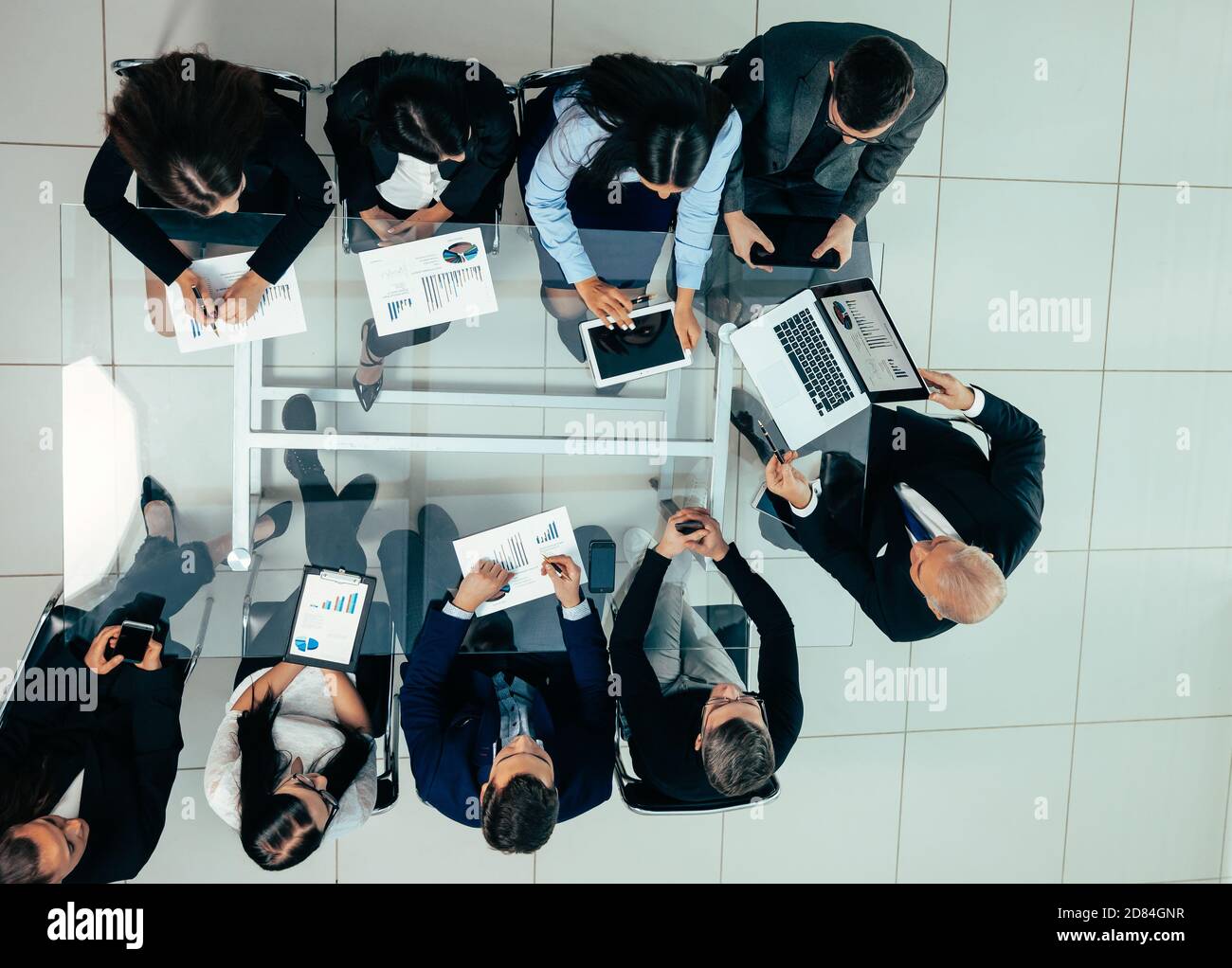 business team using a laptop to analyze financial data Stock Photo - Alamy