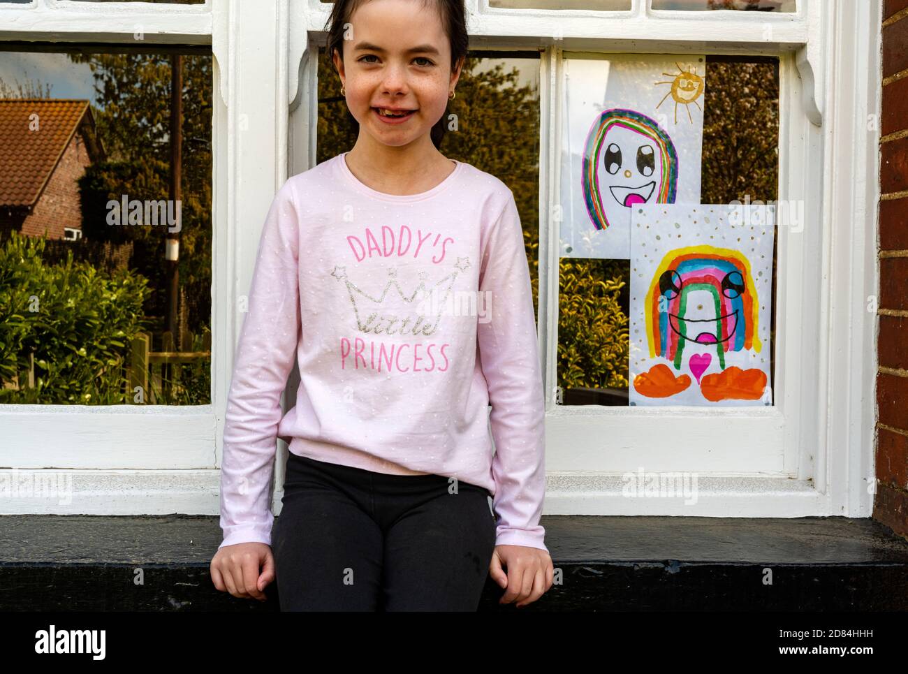 8-year old child self isolating at home during Covid-19 pandemic Stock Photo