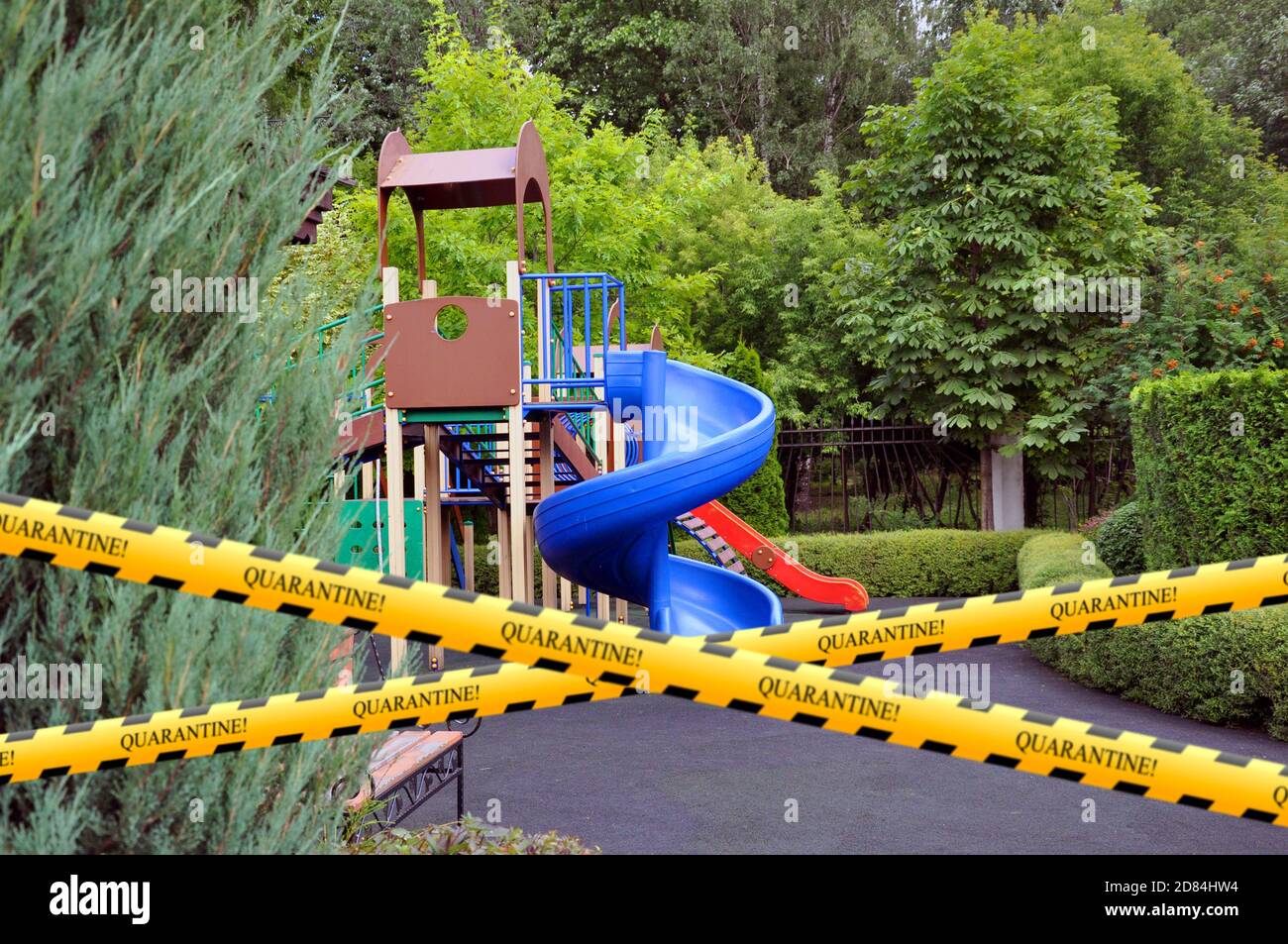 Barrier tape - quarantine. The playground is closed. There are no children in the playground in the yard. Prevention of coronavirus COVID-19. Stock Photo
