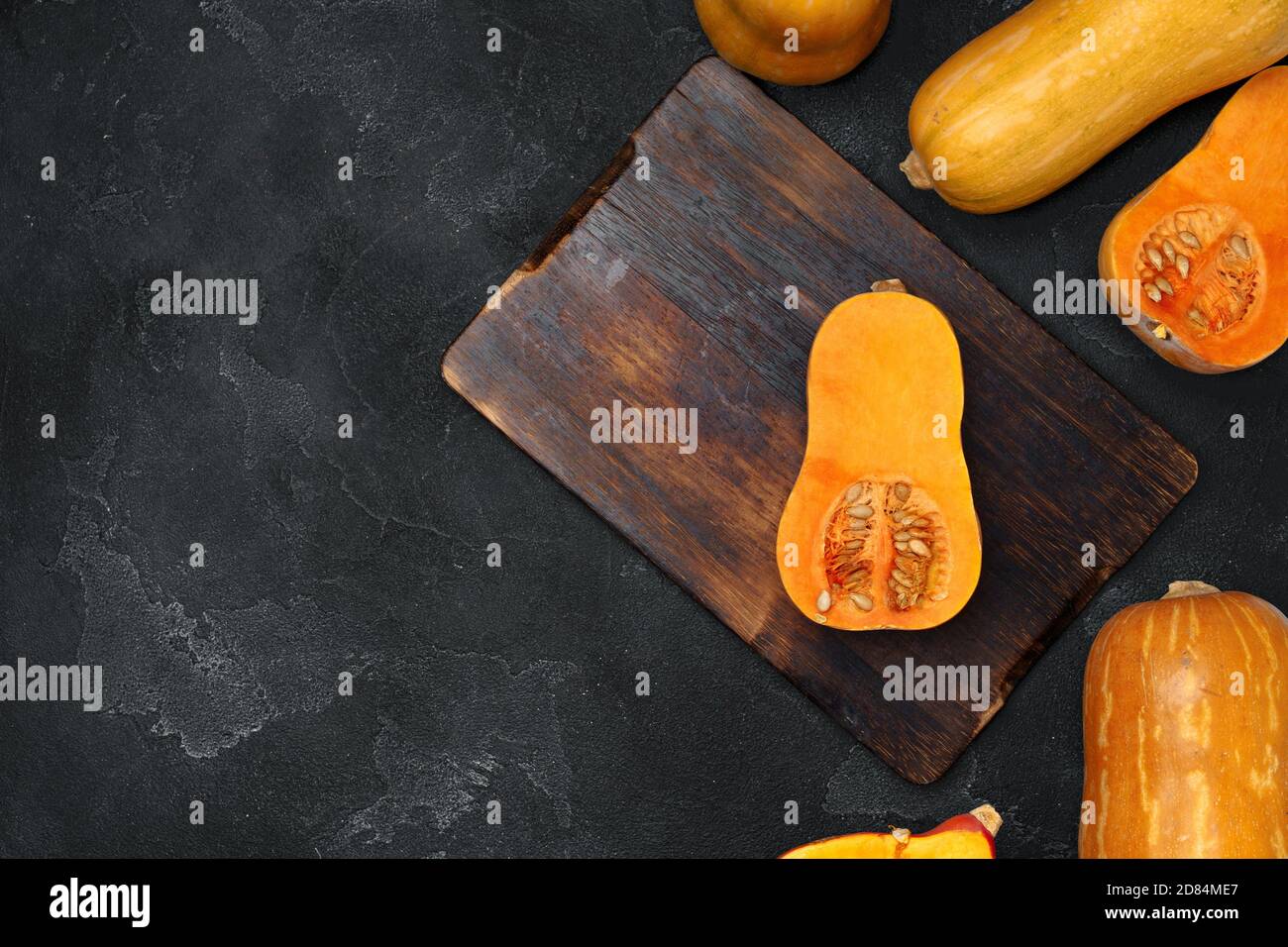 Pile of pumpkins on dark background top view Stock Photo - Alamy