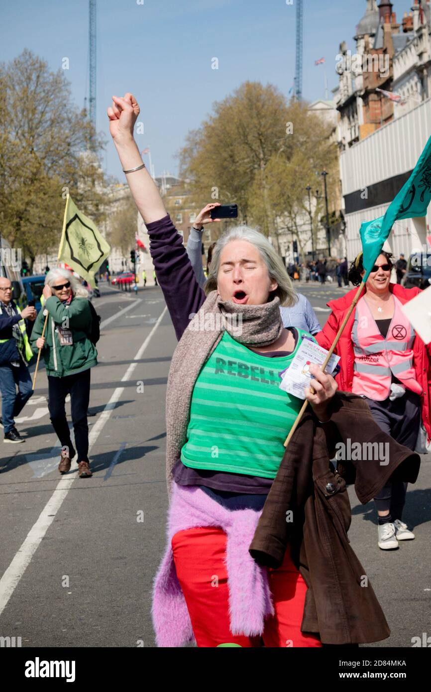London, United Kingdom, 15th April 2019:- Extinction Rebellion protesters block and march down Whitehall past Downing Street to wards Parliament Squar Stock Photo