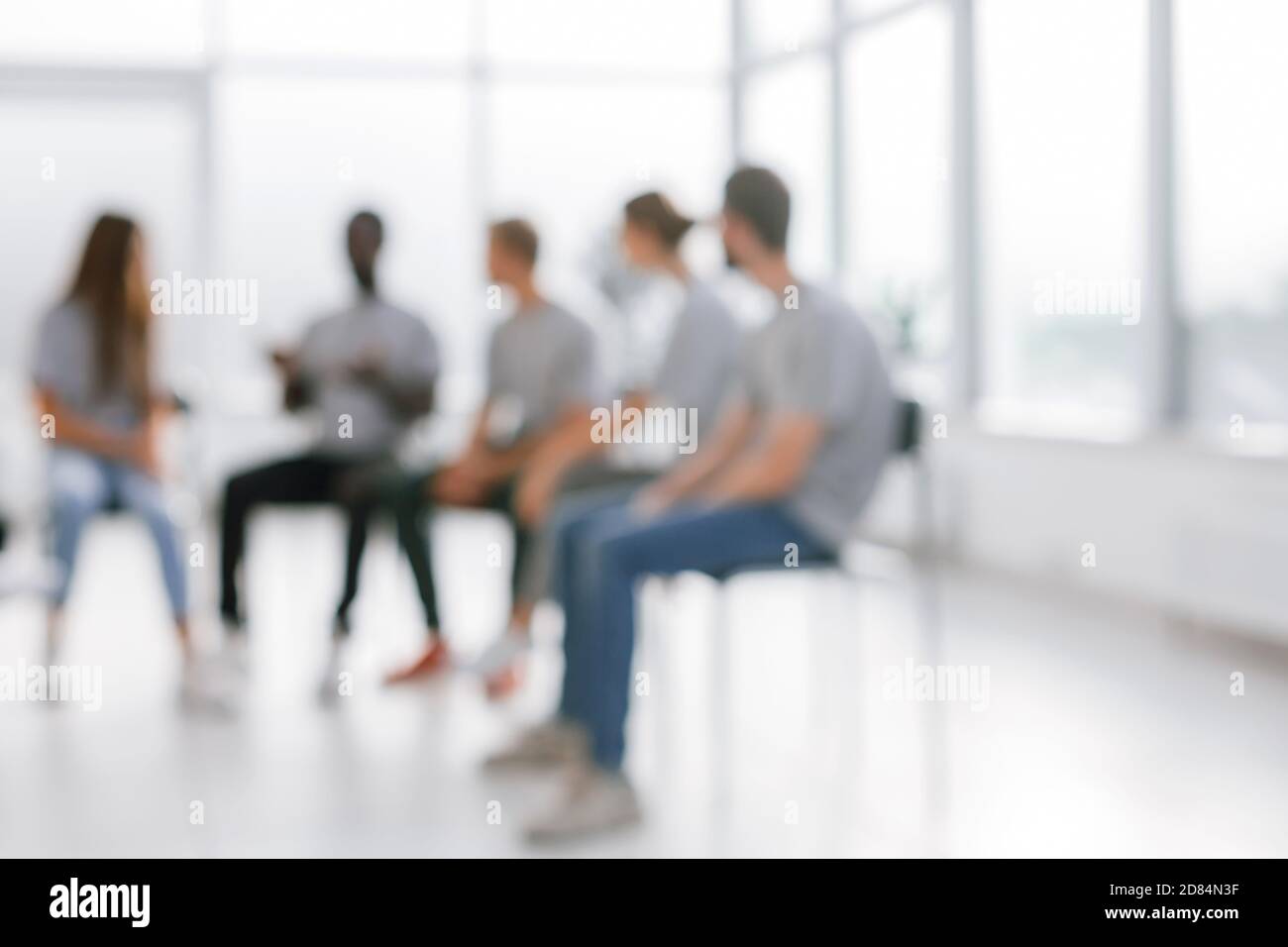 background image of a group of young people at a meeting in a ...