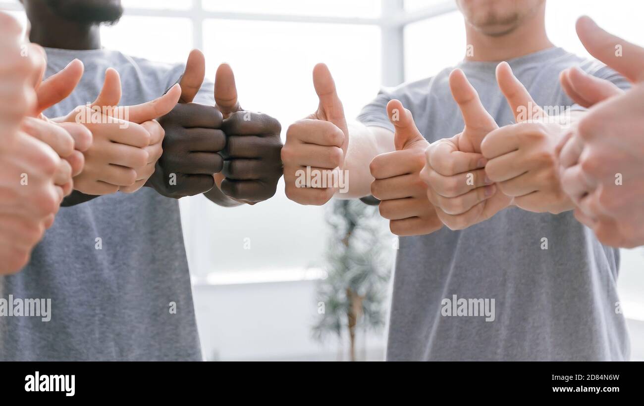 close up. group of like-minded showing thumbs up. Stock Photo