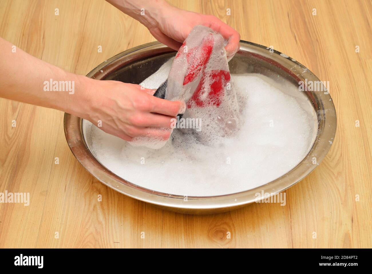 hands has being cleaning off clothes from dirt and stains Stock Photo Alamy