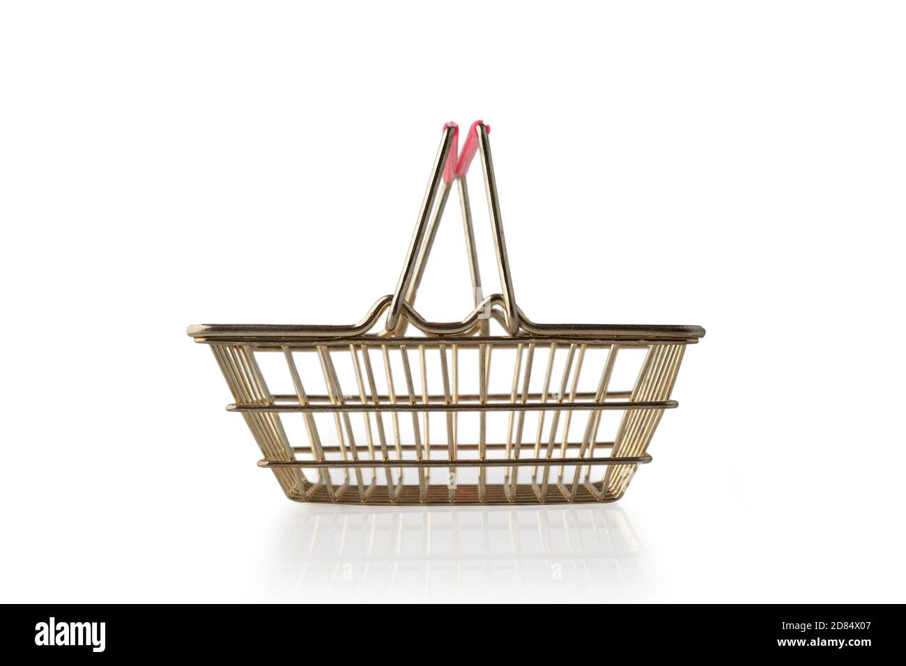 Empty metal grocery basket with raised handles for shopping in supermarket isolated on white background side view. Symbol of consumer society. Side vi Stock Photo