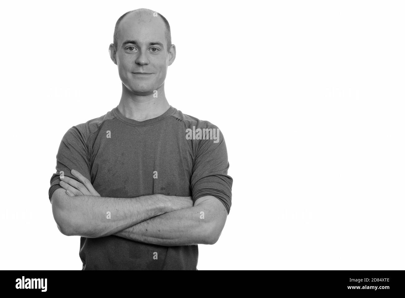 Confident bald Caucasian man with arms crossed Stock Photo