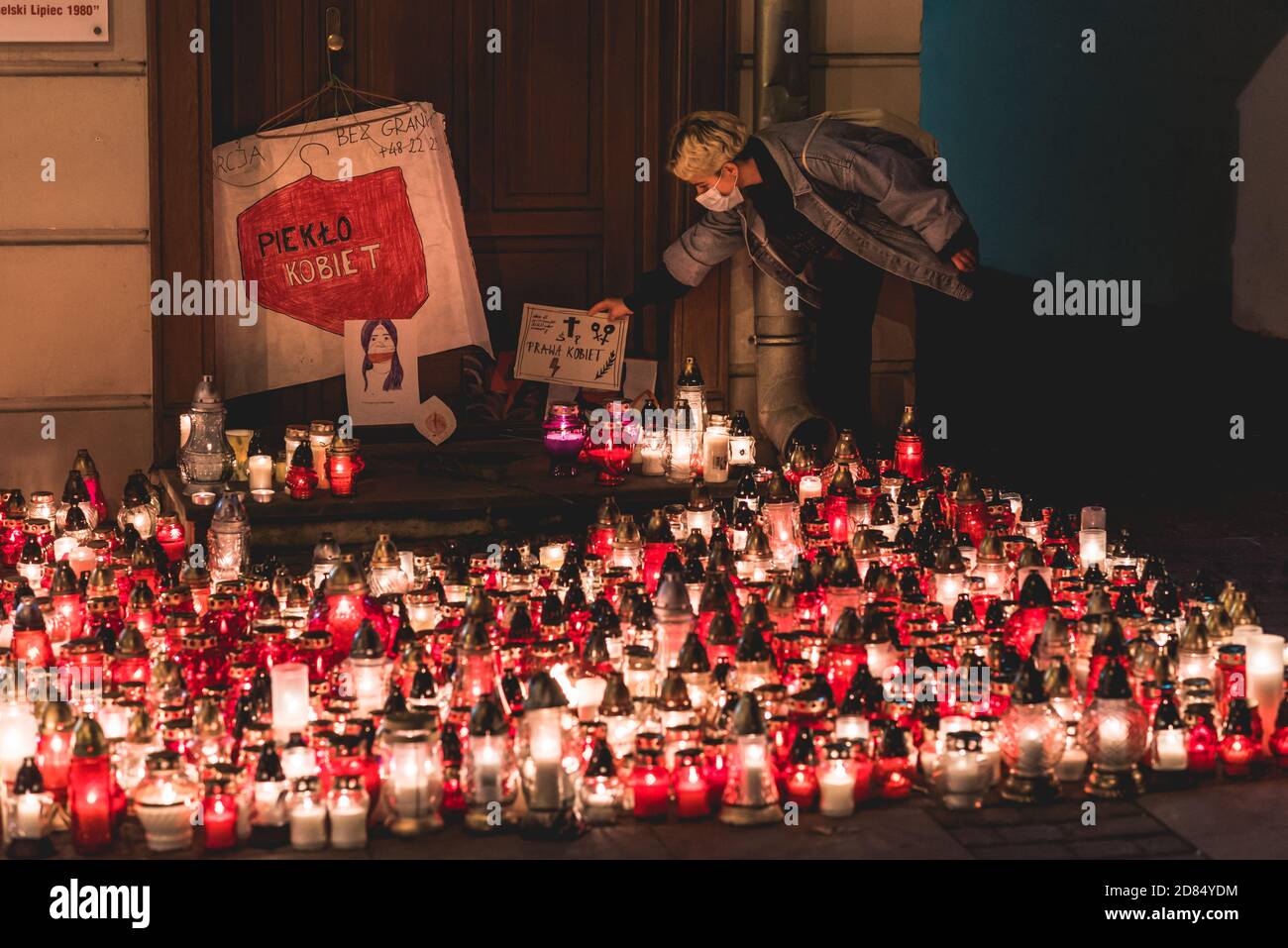 Lublin, Poland - October 23, 2020: Woman putting down the banner during protest by Strajk Kobiet against abortion ban in Poland Stock Photo