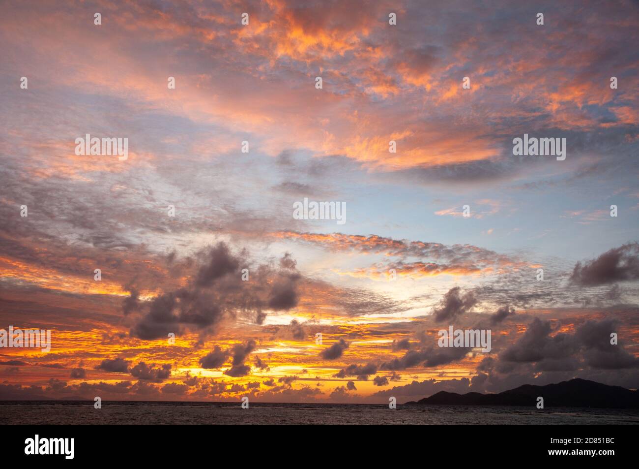 Beautiful tropical sunset over the sea horizon with vibrant color with ...