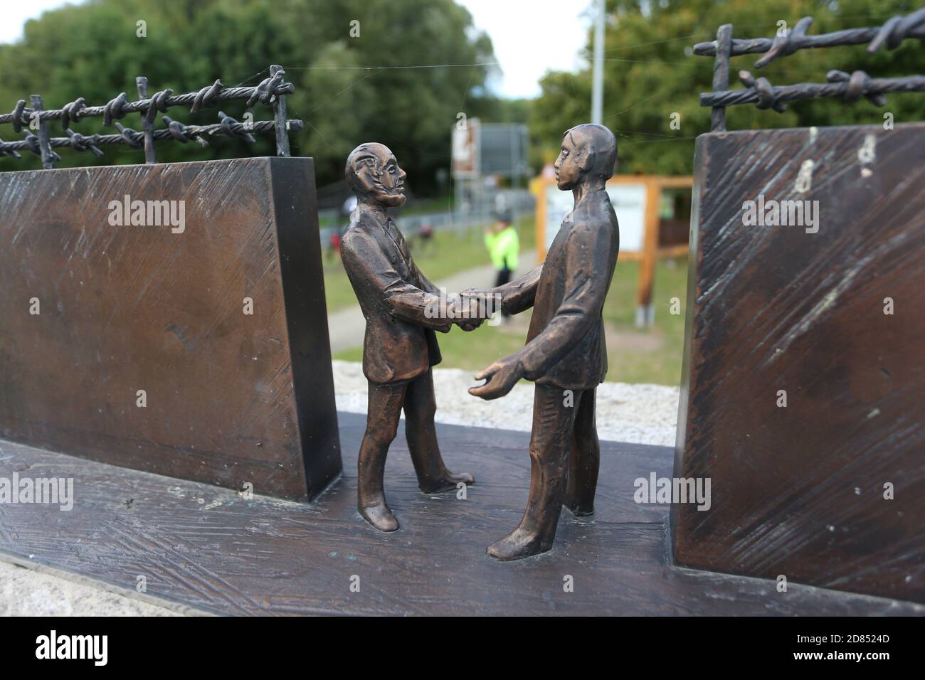 Stapelburg, Germany. 02nd Oct, 2020. At the border monument between Stapelburg in Saxony-Anhalt and Eckertal in Lower Saxony, various information panels and a bronze sculpture commemorate the opening of the border on 11.11.1989. For many visitors this also reminds them of the reunification of both German states in 1990. 30th anniversary of the reunification is celebrated with many events this year. Credit: Matthias Bein/dpa-Zentralbild/ZB/dpa/Alamy Live News Stock Photo