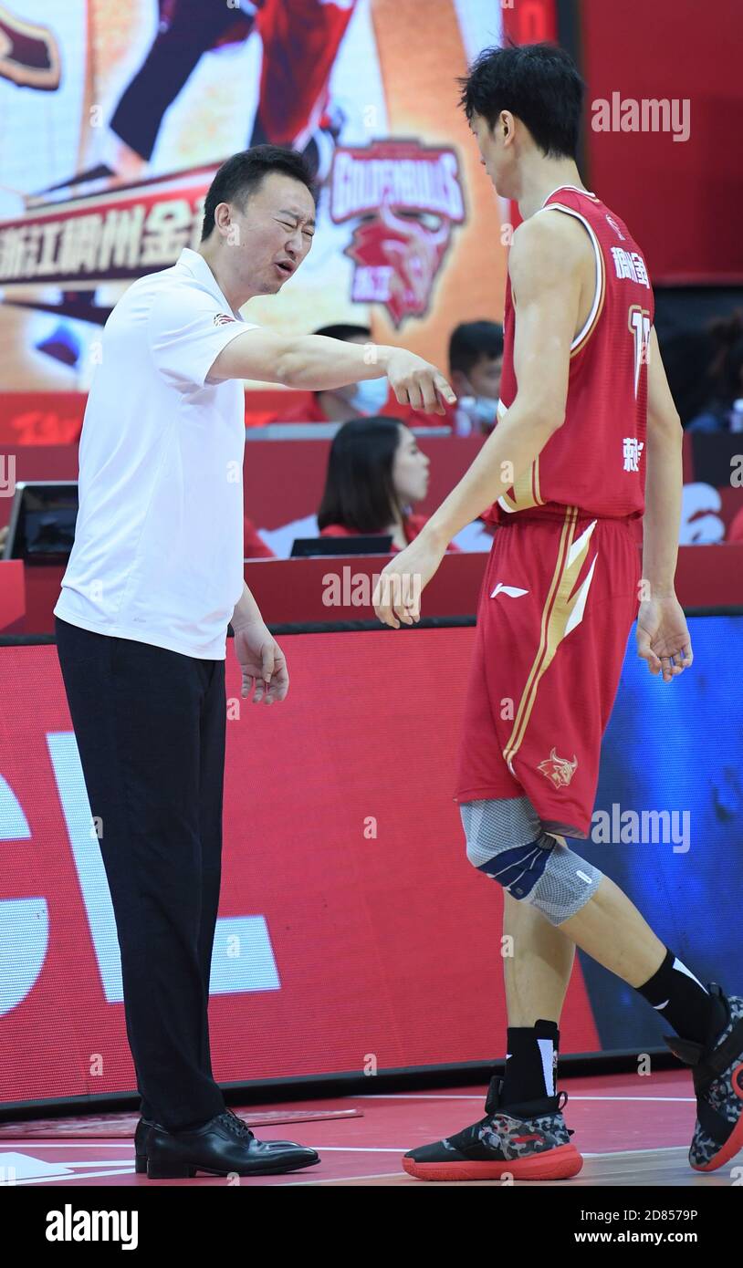 Zhuji, China's Zhejiang Province. 27th Oct, 2020. Liu Weiwei (L), head  coach of Zhejiang Golden Bulls, talks to Lai Junhao during the 5th round  match between Zhejiang Lions and Zhejiang Golden Bulls