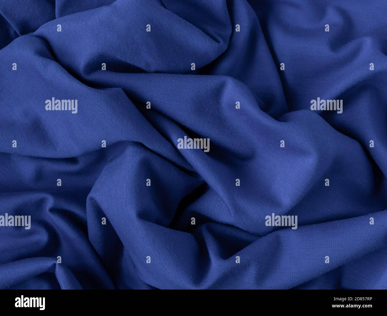 classic blue fabric sample. fabric texture, folds, closeup. selective focus Stock Photo