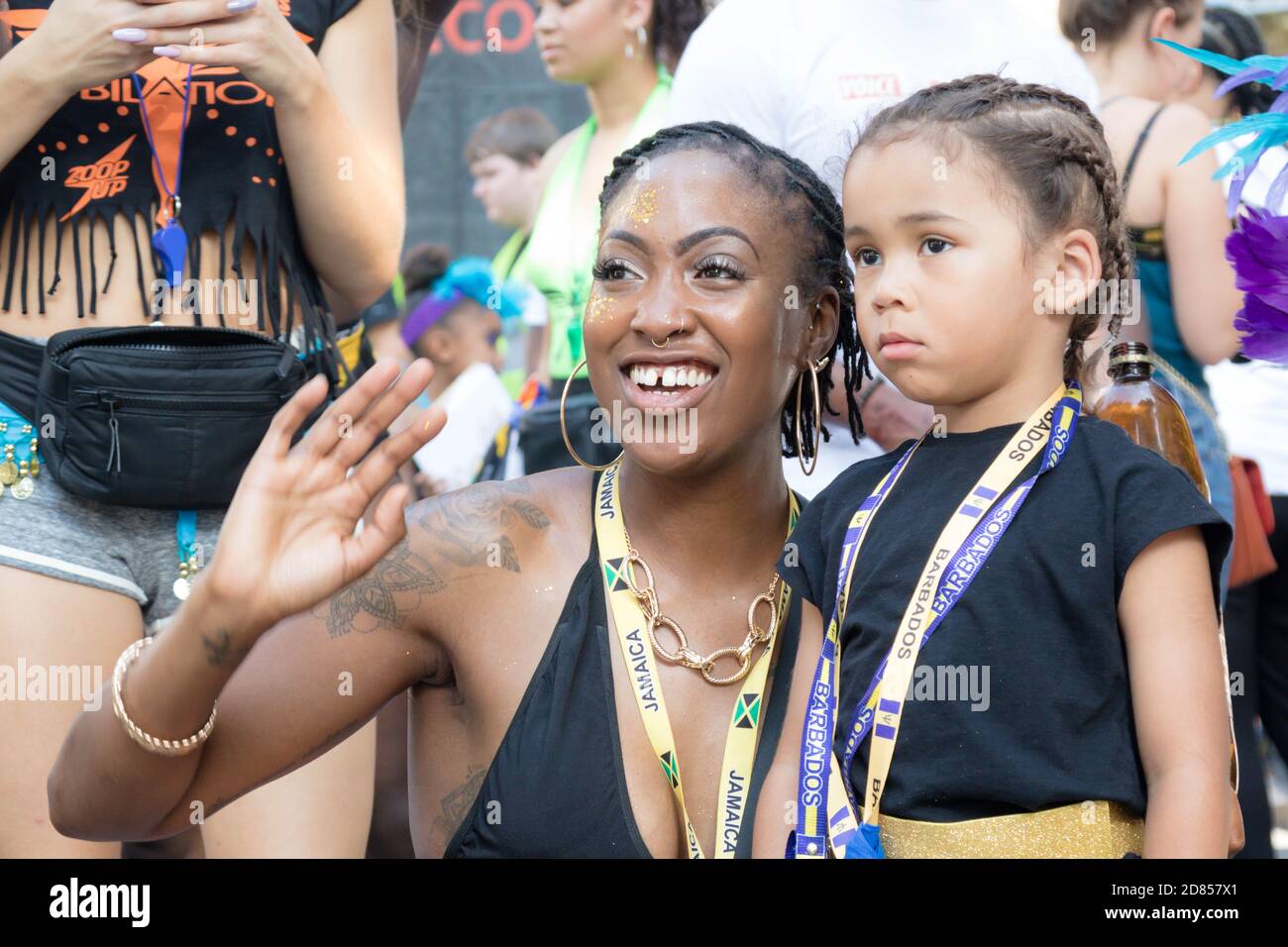 London, United Kingdom, August 25th 2019:-An adult and child reveller at the Notting Hill Carnival in West London, the Notting Hill Carnival is Europe Stock Photo