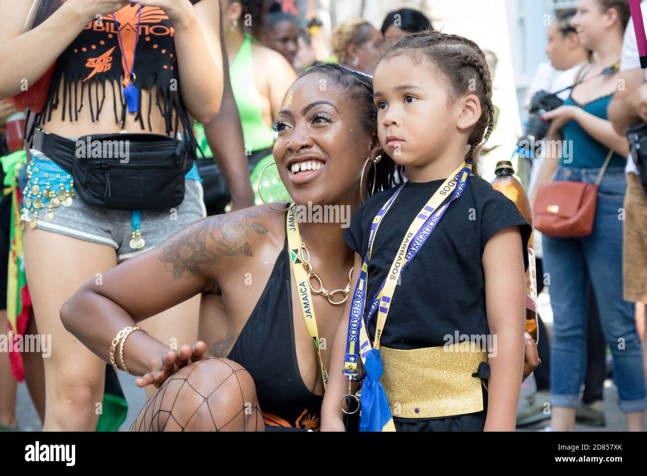 London, United Kingdom, August 25th 2019:-An adult and child reveller at the Notting Hill Carnival in West London, the Notting Hill Carnival is Europe Stock Photo