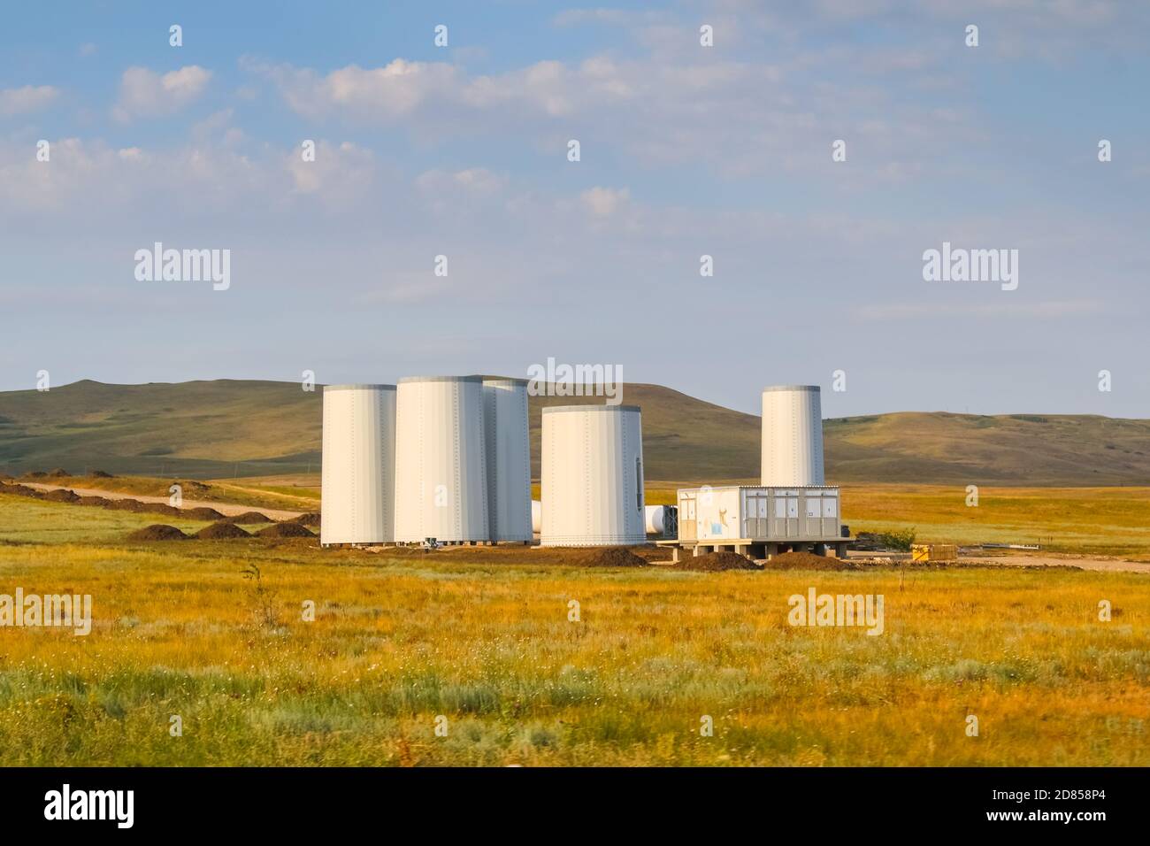 Windmill construction. Installation of a wind turbine. Blue sky Stock ...