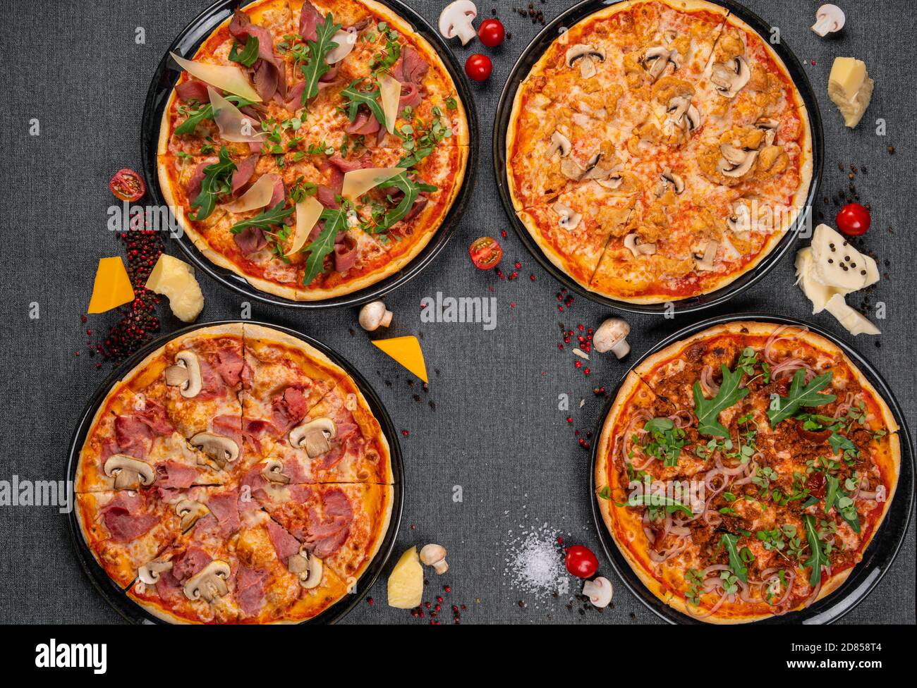Four types of pizza shot from above on wooden boards Stock Photo