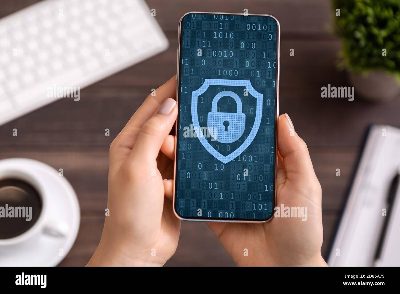 Woman using mobile phone, padlock icon on blue screen Stock Photo