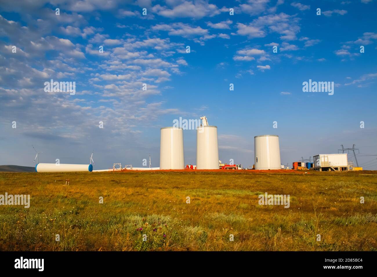 Windmill construction. Installation of a wind turbine. Blue sky Stock ...