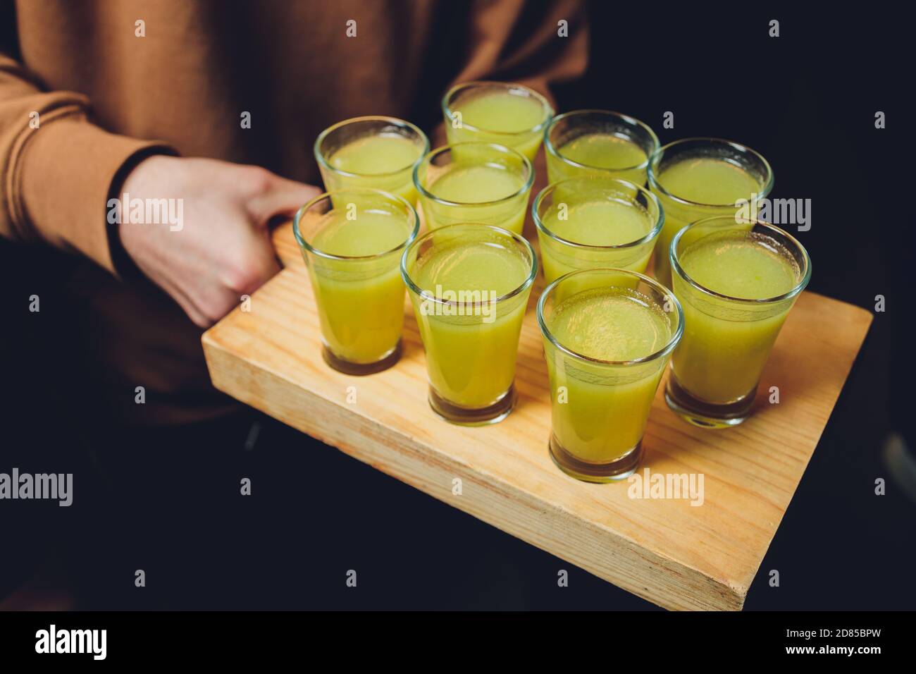 Various alcoholic shots in shot glasses in a serving tray often 