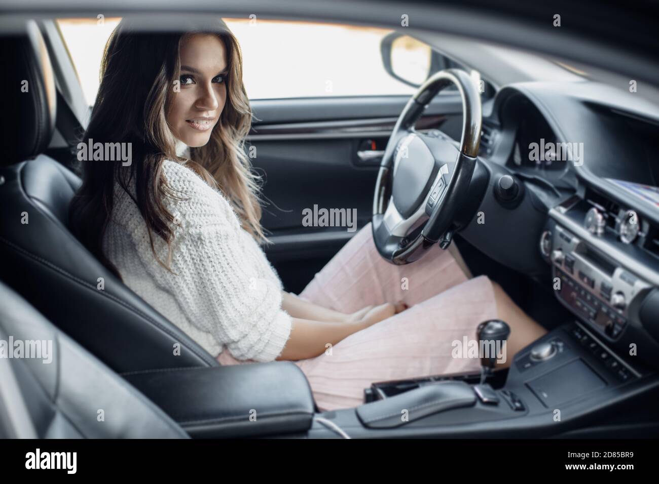 Sitting at steering wheel hi-res stock photography and images - Alamy