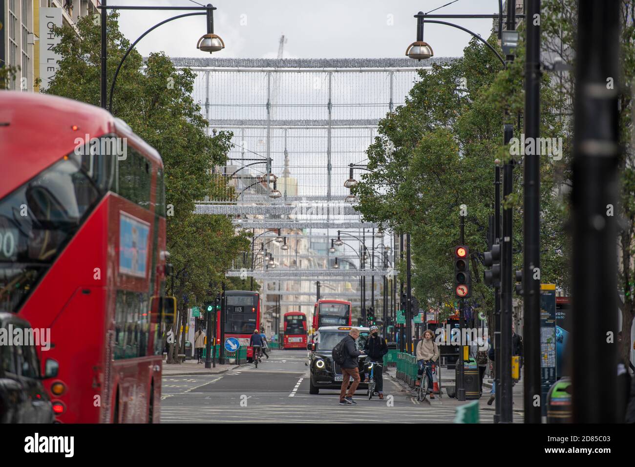 Buses along Oxford Street in London, currently in Coronavirus Tier 2, 2020 Christmas light installations installed overhead. 26 October 2020. Stock Photo
