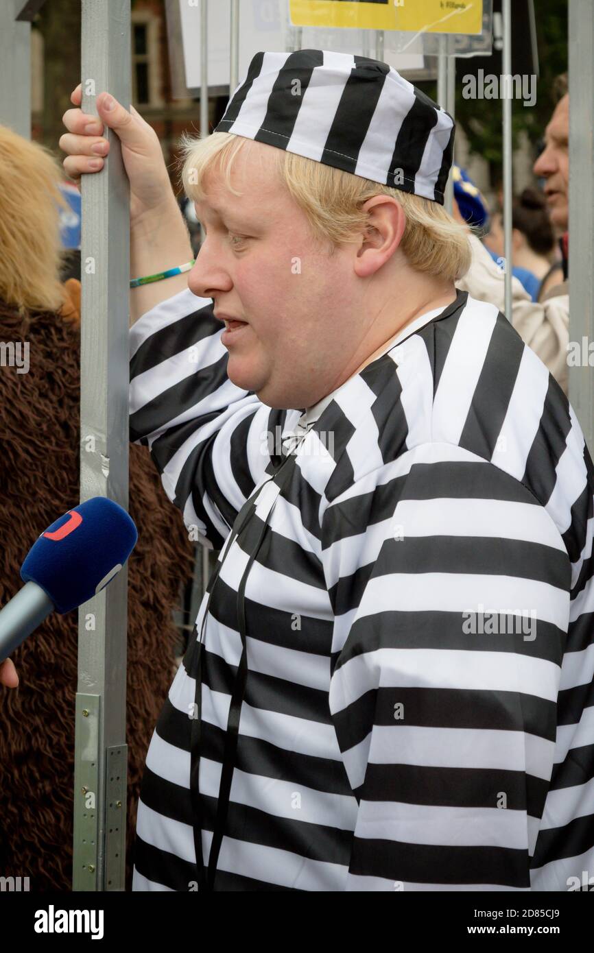 London, United Kingdom, June 4th 2019:- A Boris Johnson lookalike dressed in Prison Uniform in Parliament Square protesting against the up coming cour Stock Photo
