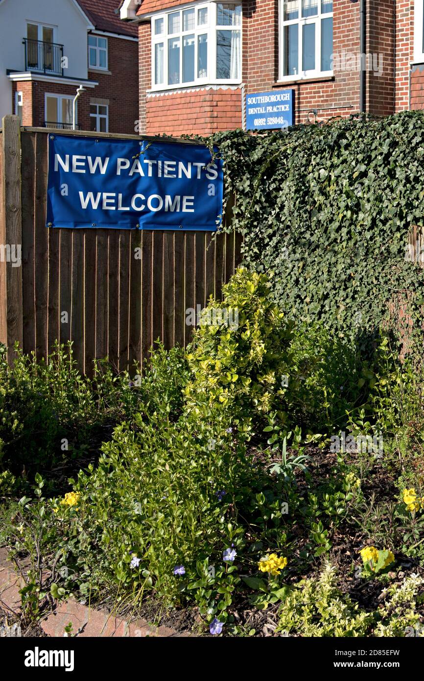 A sign welcoming new patients to a NHS (National Health Service) dental practice in England. Admission to NHS dental practice is difficult in 2022 as . Stock Photo