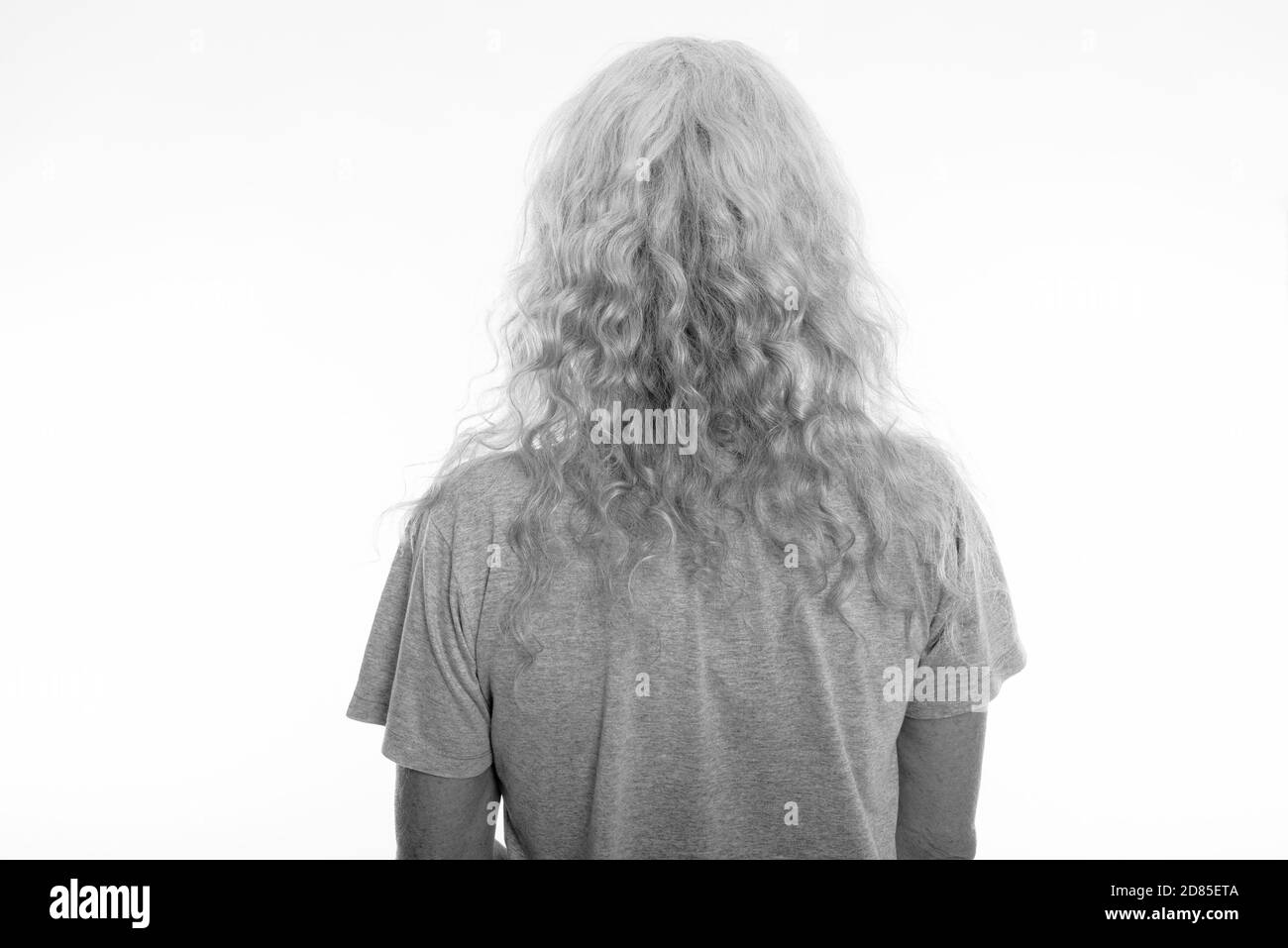 Close up back view of senior bearded man with long curly white hair Stock Photo