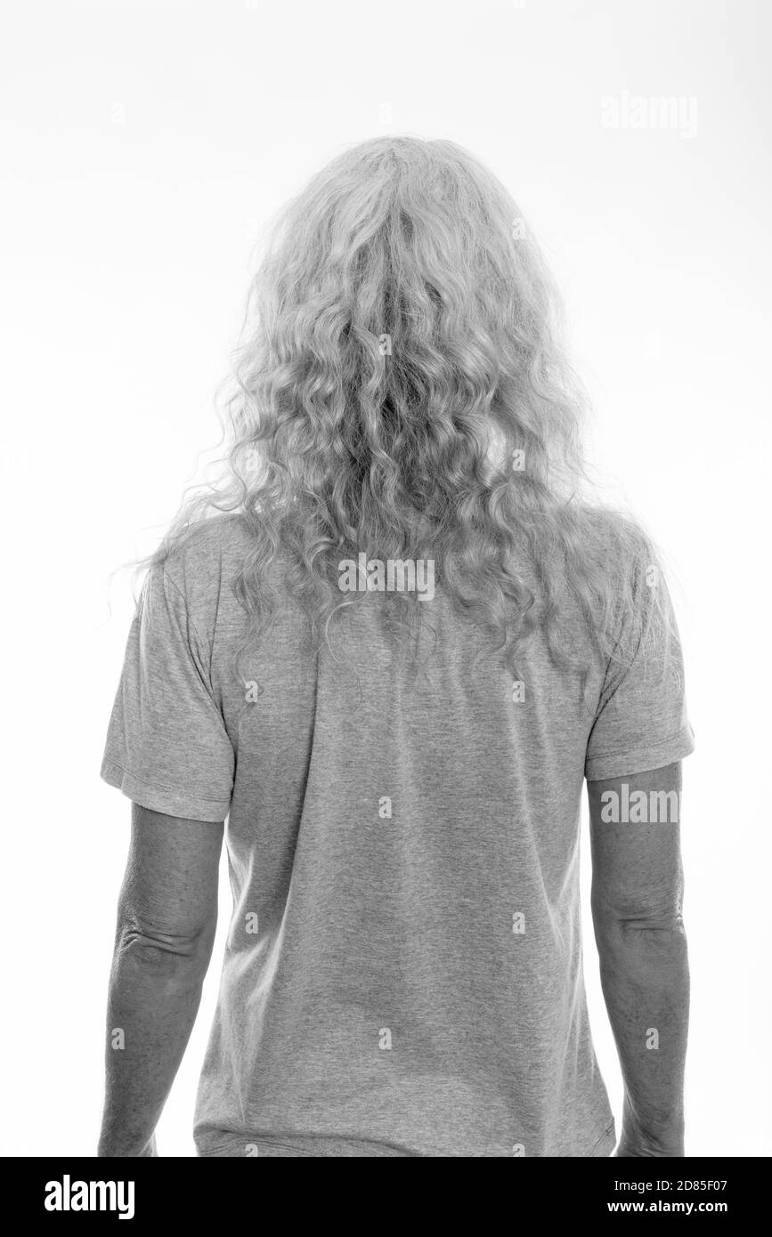 Back view of senior bearded man with long curly white hair Stock Photo