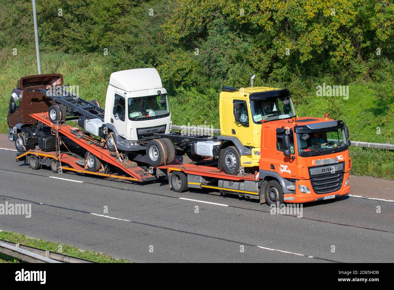 De Rooy Leyland Haulage delivery trucks, lorry, transportation, truck, cargo carrier, new DAF LF vehicles, European commercial transport, industry, M61 at Manchester, UK Stock Photo